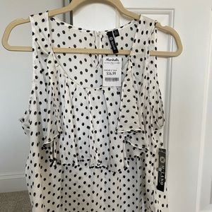 Flowy blouse with polka dots.